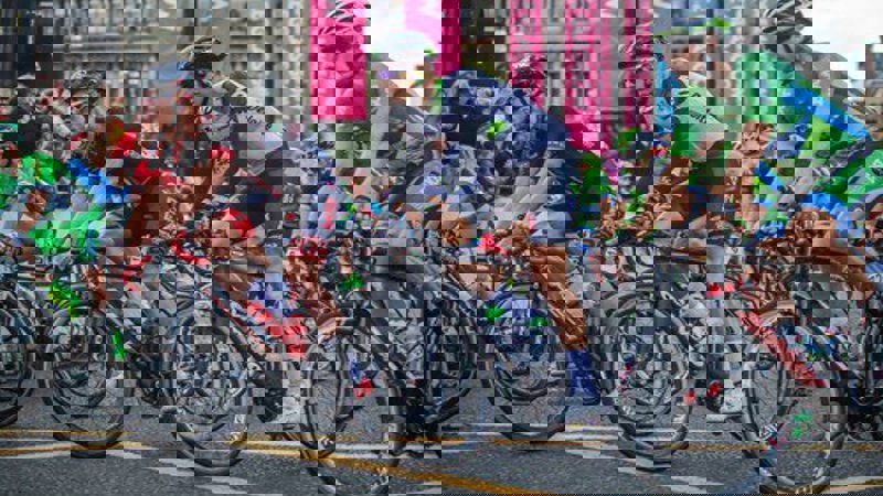 Professional cyclists racing around George Square